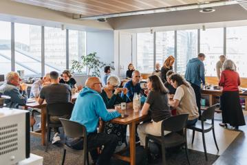 Toast Tuesdays, people socialising over breakfast at Taiawa Tech Hub