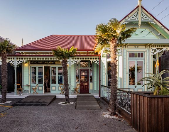 The cozy cottage exterior of The House of Good Fortune.