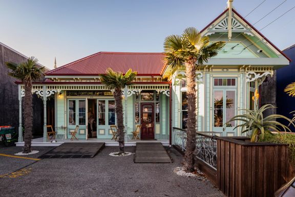 The cozy cottage exterior of The House of Good Fortune.