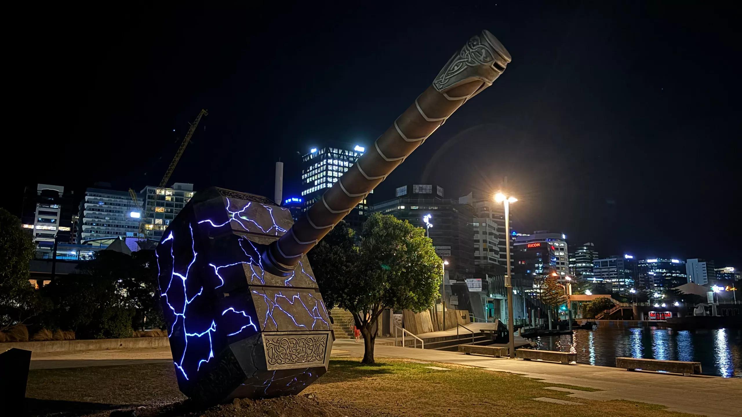 Thor's Hammer lit up at night at Whairepo Lagoon near Wellington's waterfront.