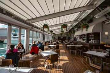 Customers enjoy their meals inside Dockside on the Queens Wharf in Wellington.