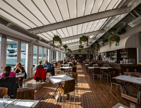 Customers enjoy their meals inside Dockside on the Queens Wharf in Wellington.