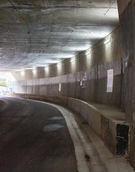 The urban setting of the Hutt Road Ngauranga Interchange, where highways got over tunnels with walls that once had graffiti.