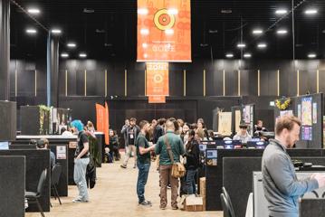 Delegates walk around the New Zealand Game Developers Conference.