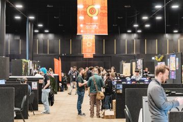 Delegates walk around the New Zealand Game Developers Conference.