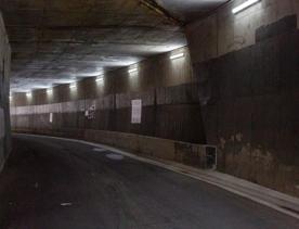 The urban setting of the Hutt Road Ngauranga Interchange, where highways got over tunnels with walls that once had graffiti.