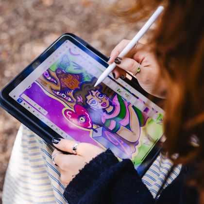Josie Selkirk the 2025 Wellington Advent Calendar artist drawing on an iPad