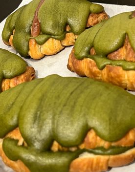 Four pastries with a green matcha icing at Creamy and Crunchy, a café on Upper Cuba Street in Wellington.