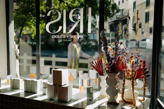 Inside Iris Store + Studio looking out to the street, with dried flowers in a vase and their products by the window.