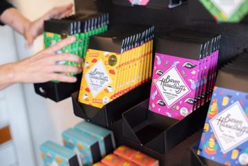 A selection of Baron Hasselhoff's chocolate bars in colourful packaging.