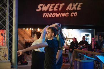 People axe throwing at Sweet Axe in Wellington.