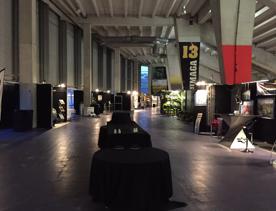 The concourse of the Hnry Stadium conference centre with stands either side of the path.