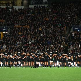 The All Blacks New Zealand rugby team stand, arm in arm, during the All Blacks v Australia Lipovitan-D Rugby Championship match, Sky Stadium, Wellington, New Zealand, Saturday, 28 September 2024.