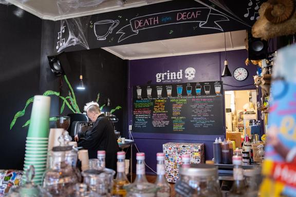 The dark themed interior of Grind Coffee Lounge Upper Hutt.