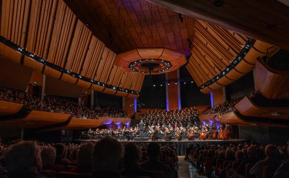 Orchestra Wellington perform on stage at Michael Fowler Centre.