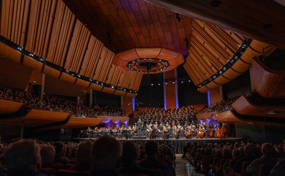 Orchestra Wellington perform on stage at Michael Fowler Centre.