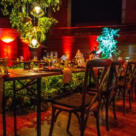 A stage set up in the Michael Fowler Centre as a dinner event.