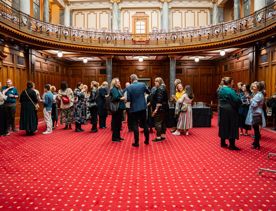 People gathering inside Parliment for the progressive dinner.
