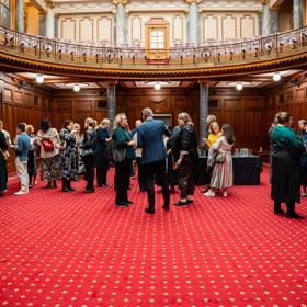 People gathering inside Parliment for the progressive dinner.