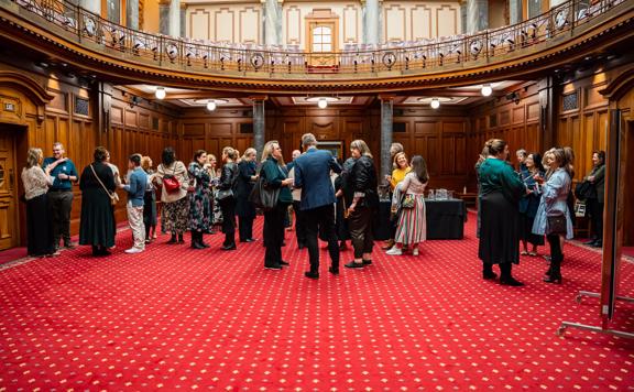 People gathering inside Parliment for the progressive dinner.