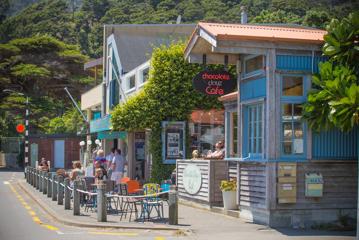 Customers enjoy sitting in the sun at chocolate Dayz Cafe and Van Helden Gallery.