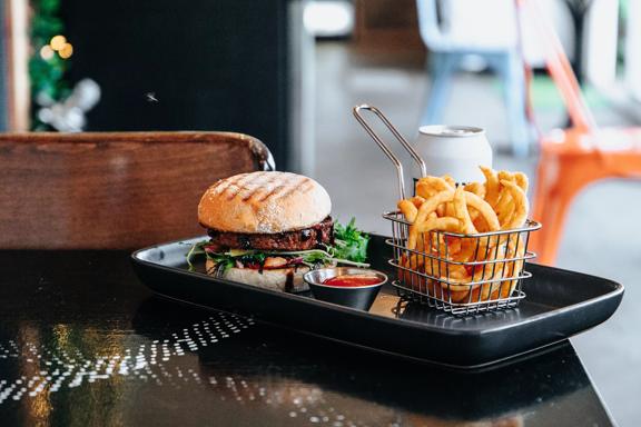 Burger and fries served at Get Fixed Bicycle Cafe Porirua.