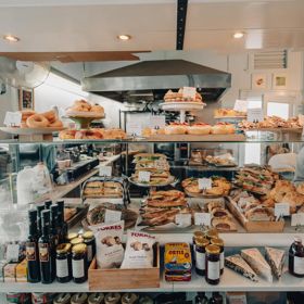 The front counter at Tomboy is filled with sandwiches, baked goods and European deli treats.