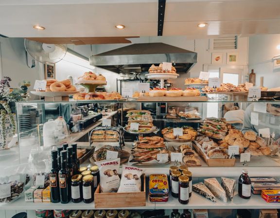 The front counter at Tomboy is filled with sandwiches, baked goods and European deli treats.