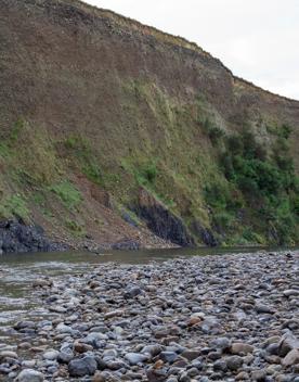 The screen location of Te Mārua  cliffs, where a river flows against vertical cliffs on the foothills of the Remutaka Range.