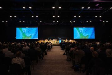 People watch a presentation at WaterNZ's conference at Tākina.
