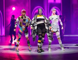 Three models wear eclectic outfits made of fragmented fabrics.