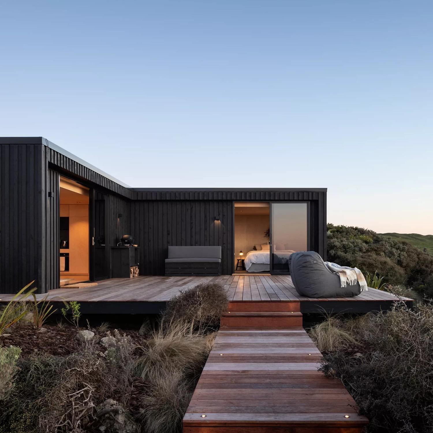 Pipinui Point is a cliffside luxury cabin located in Johnsonville, Wellington, surrounded by nature at every viewpoint.