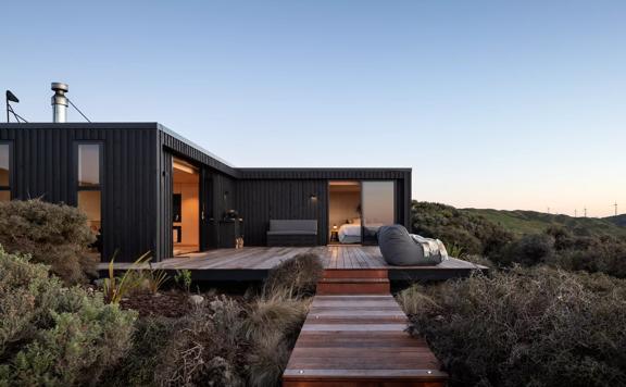Pipinui Point is a cliffside luxury cabin located in Johnsonville, Wellington, surrounded by nature at every viewpoint.