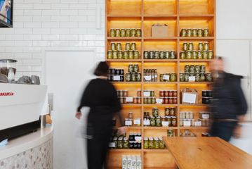 The shelves of pickled products at Pickle & Pie café in Wellington.
