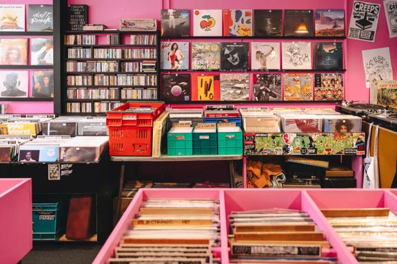 The interior of Creeps Record Parlour, a quirky record store with pink walls located in Newtown, Wellington, New Zealand.