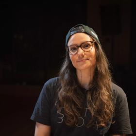 Portait of Casey Zilbert against a black backdrop.