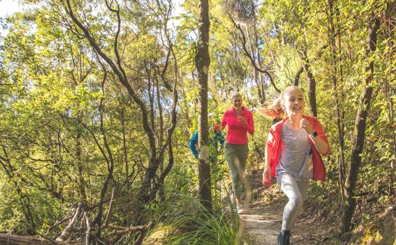 A family runs along the path of Fensham Reserve in Wairarapa.