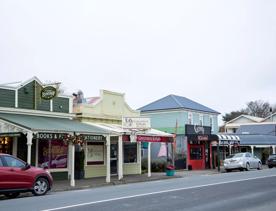 The screen location of Greytown, a historic small town featuring Victorian buildings,  stables, colonial cottages, and rural landscapes surrounding.