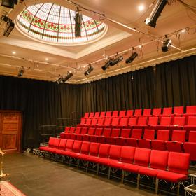 The gold and red interior of Bats Theatre.