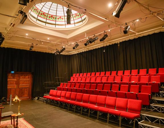 The gold and red interior of Bats Theatre.