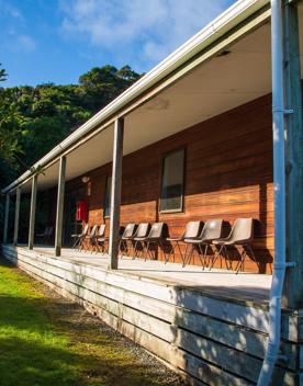 Camp Wainuiomata screen location. Has several buildings and is surrounded by forest and bush.