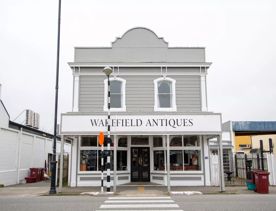 The screen location of Greytown, a historic small town featuring Victorian buildings,  stables, colonial cottages, and rural landscapes surrounding.