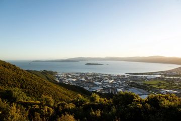 View from the Wainuiomata Hill Lookout, looking over an industrial area towards Wellington City and Matiu/Somes Island.