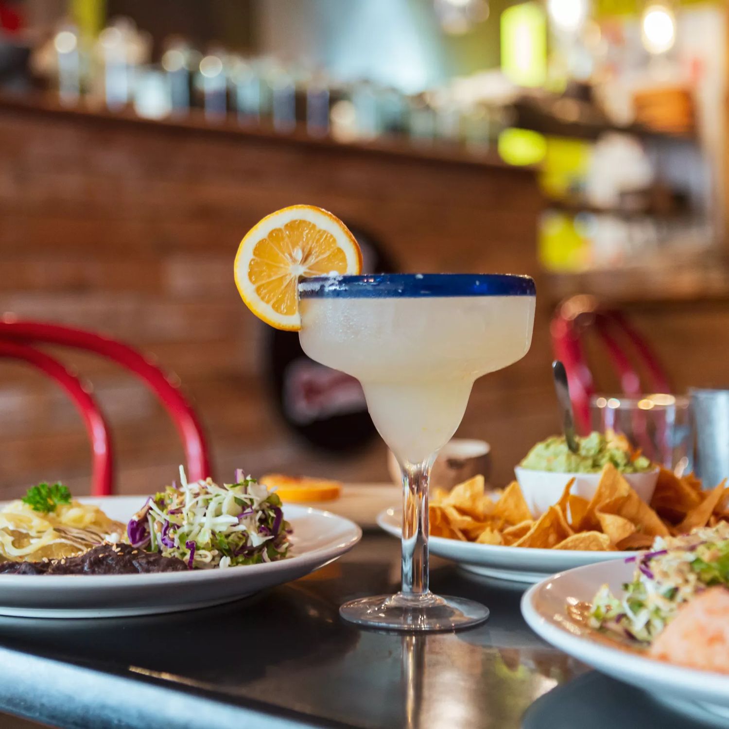 A frozen lime margarita and three Mexican dishes are on a table at Viva Mexico, a restaurant on Jackson Street in Petone, Lower Hutt, Wellington.