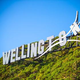 The Windy Wellington sign on a green hill in Miramar, Wellington, New Zealand.