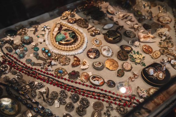 Antique earrings, necklaces and broaches, in a display case at Ziggurat, a secondhand store located in Wellington, New Zealand.