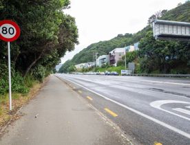 The urban setting of the Hutt Road Ngauranga Interchange, where highways got over tunnels with walls that once had graffiti.