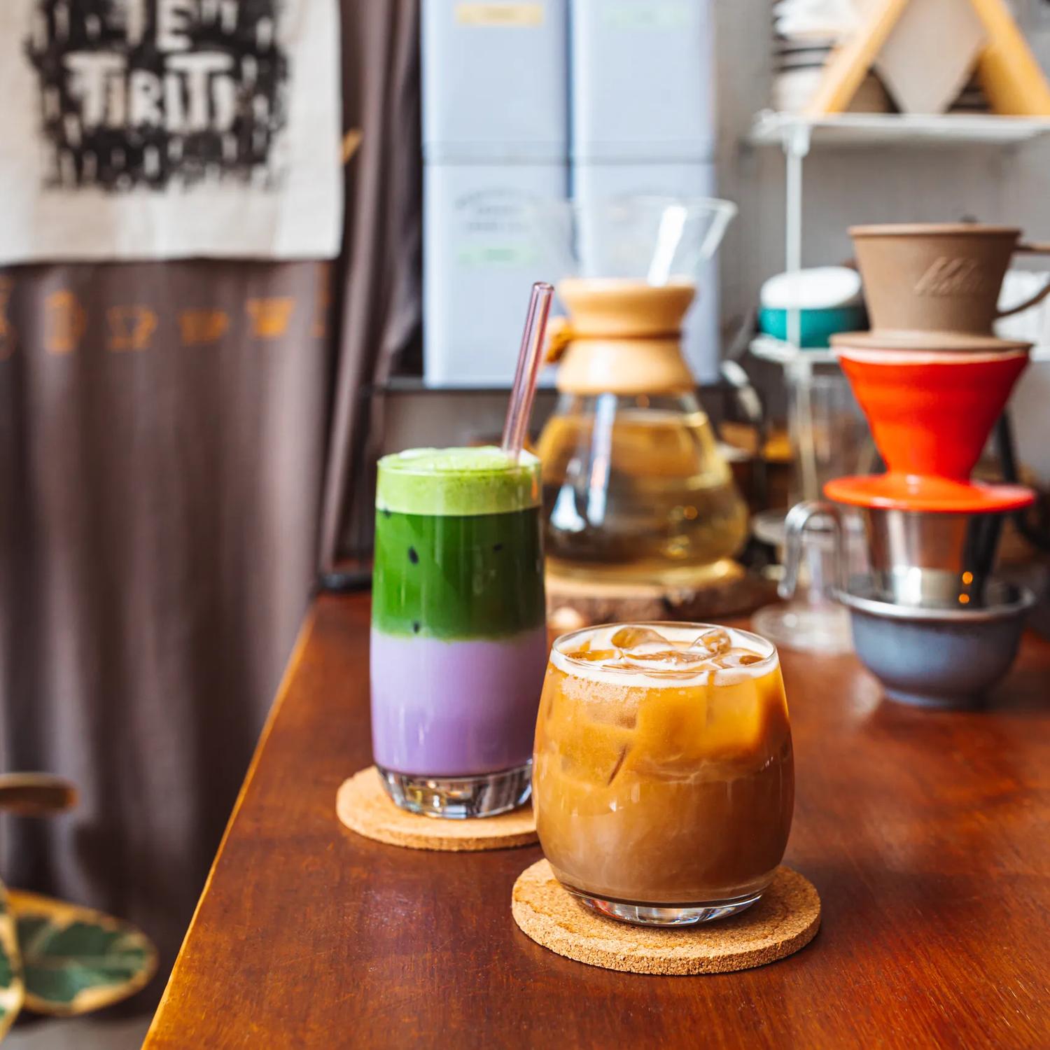 Two iced drinks on the counter at Pour & Twist.