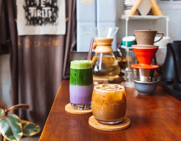 Two iced drinks on the counter at Pour & Twist.