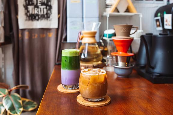 Two iced drinks on the counter at Pour & Twist.